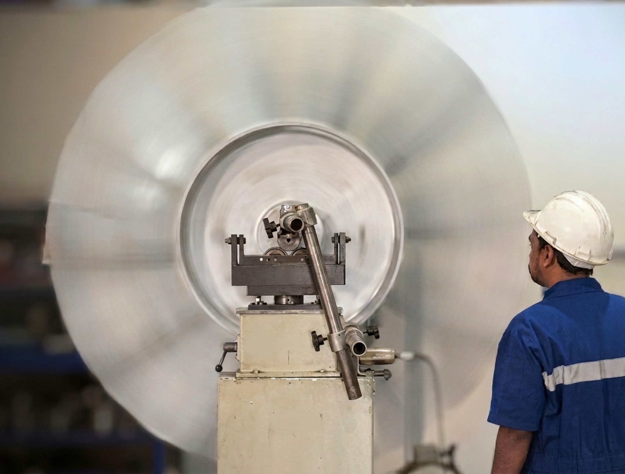 Technician performing dynamic balancing of rotating machinery